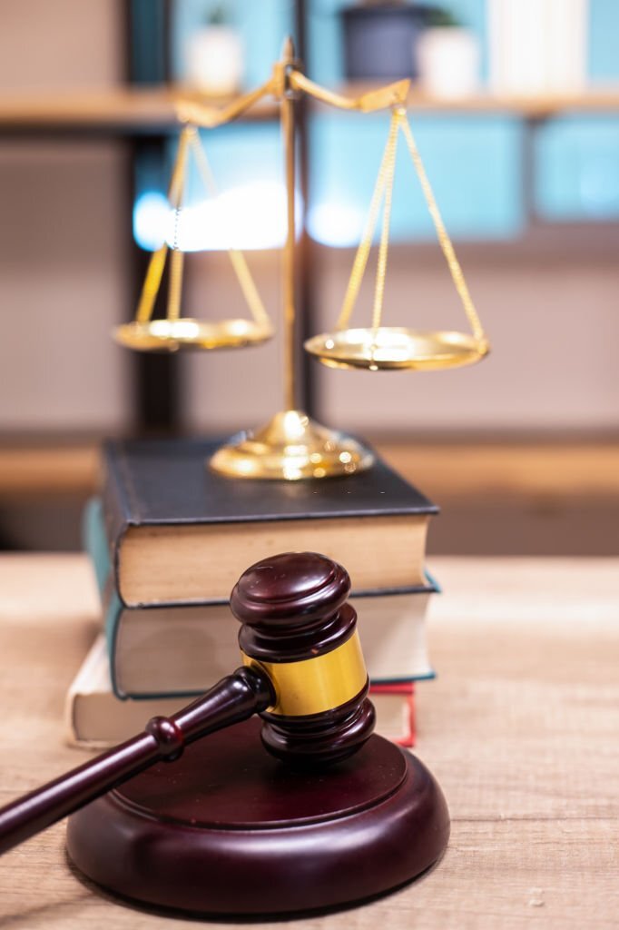 Justice Scales and books and wooden gavel